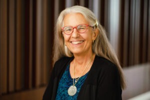 Professor Leslie Francis, an older white woman with long silver hair and glasses