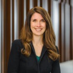 Assistant professor Beth Parker, a young white woman with long light-brown hair