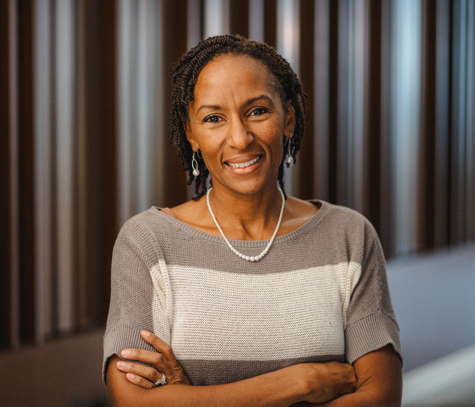 Clinical Professor Leslie Culver, a Black woman with short black hair wearing a tan sweater