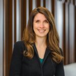 Associate professor Beth Parker, a young white woman with long light-brown hair