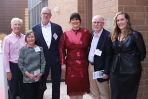 Brian Katz, left, Pat Leith, George Petrow, Dean Elizabeth Kronk Warner, Kelley Gale, and Lexie Kite stand together at the Alumni Awards celebration at the College of Law