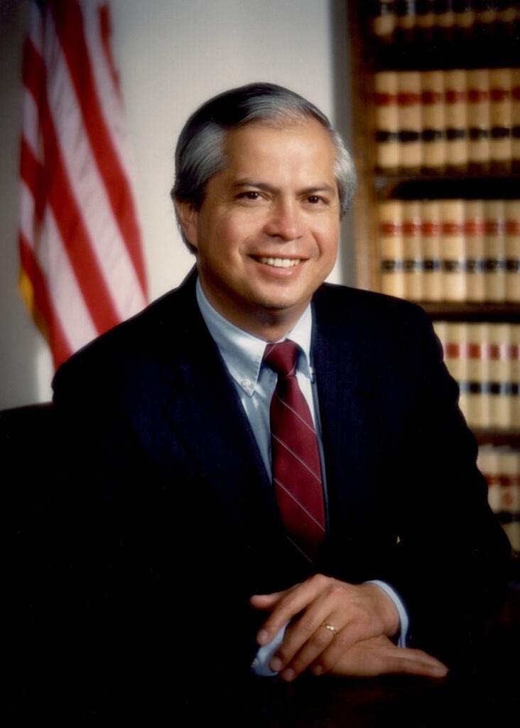 Larry EchoHawk, a middle-aged Native American hair with black hair graying at the temples