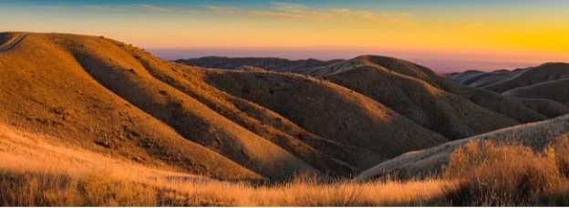 Sunset over golden hills in fall